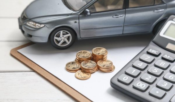 car-model-calculator-coins-white-table