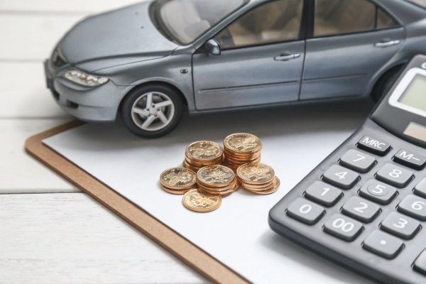 car-model-calculator-coins-white-table
